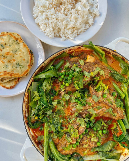 Slow cooked red curry lamb shanks with spring onion flat breads