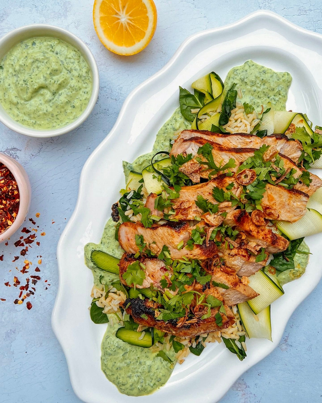 Peruvian inspired pork with creamy Aji Verde & brown rice.