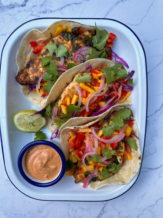 Chipotle fish tacos with a creamy chipotle sauce and mango salsa