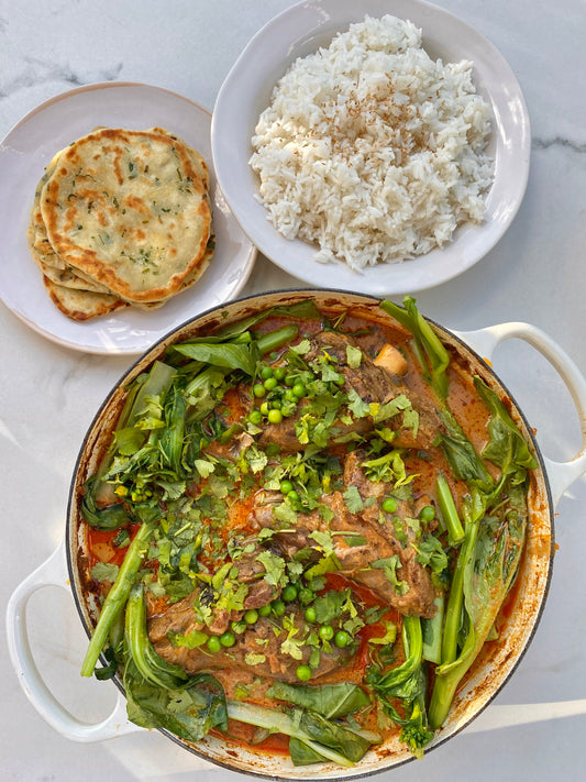 Slow cooked red curry lamb shanks with spring onion flat breads