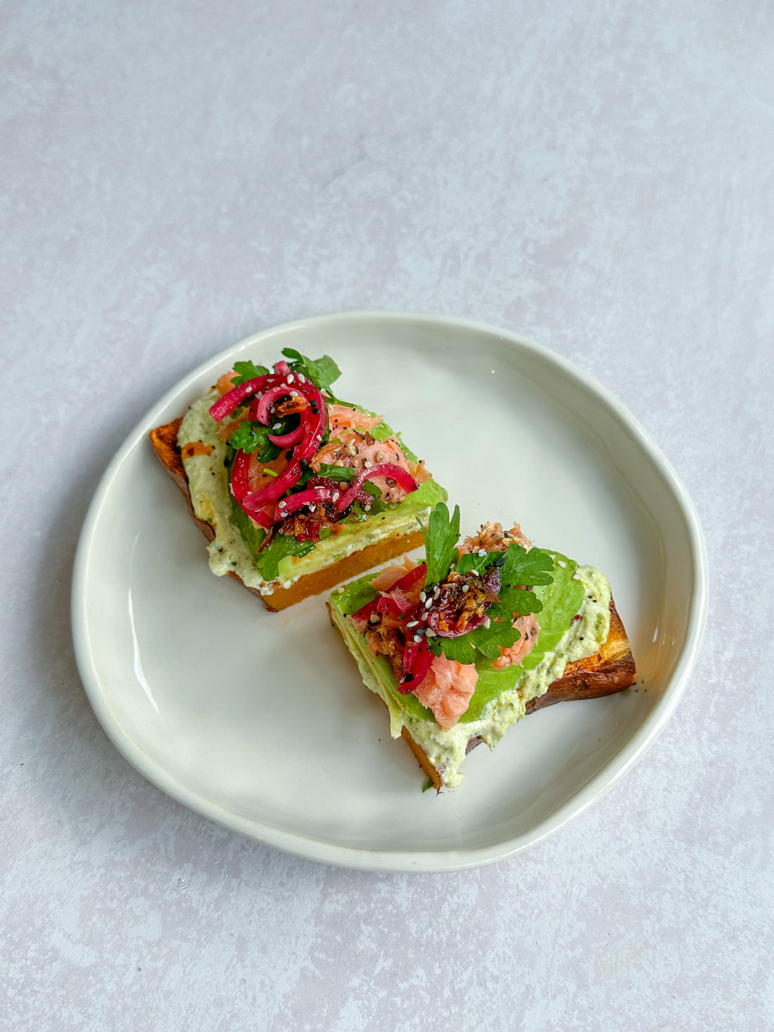 Salmon & avocado kumara toast with a herby ricotta spread