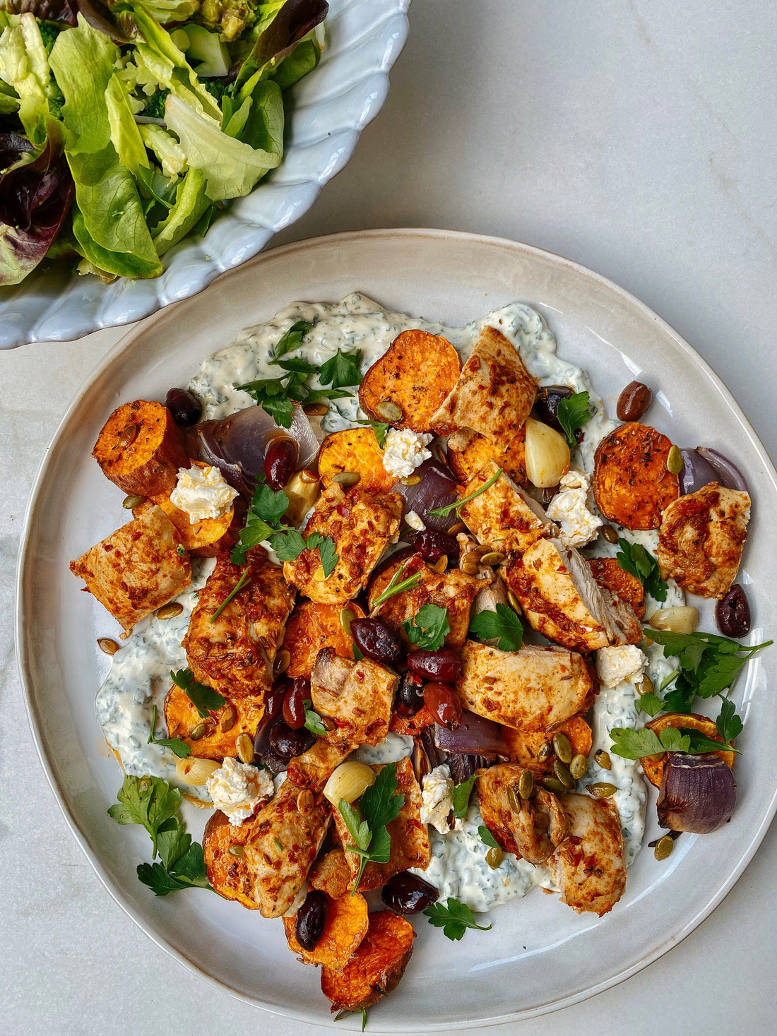 Harissa chicken with roasted kumara, olives and a yoghurt dip