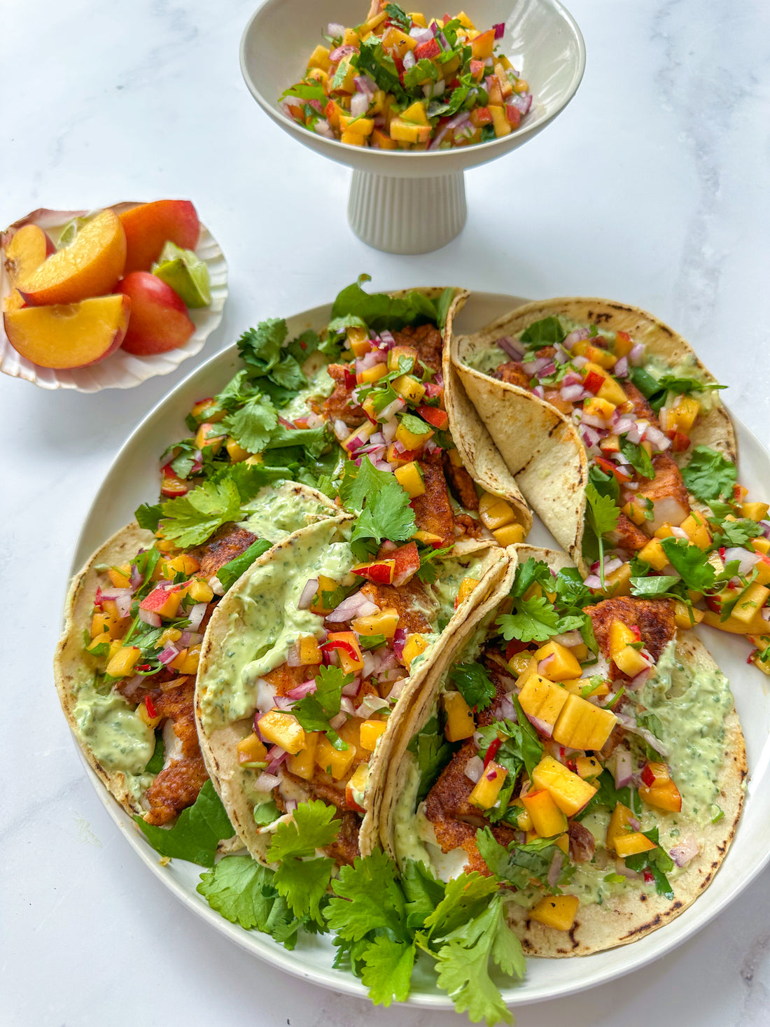 Nectarine & peach salsa, avocado cream and chipotle fish tacos