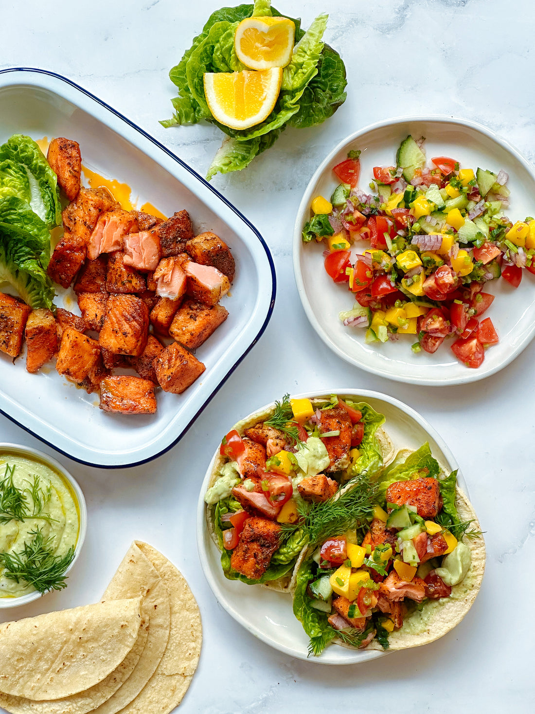 Sweet & spicy Cajun salmon tacos with a mango salsa and avocado whip.