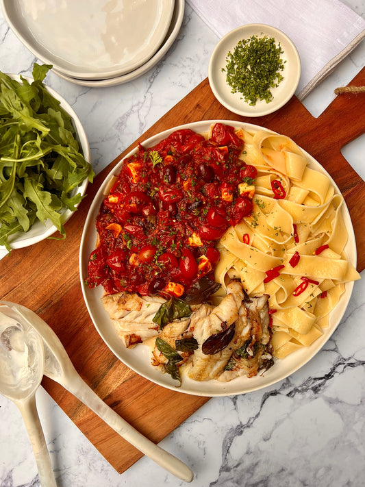 Buttery pan fried Hoki with a rich tomato sauce and pappardelle