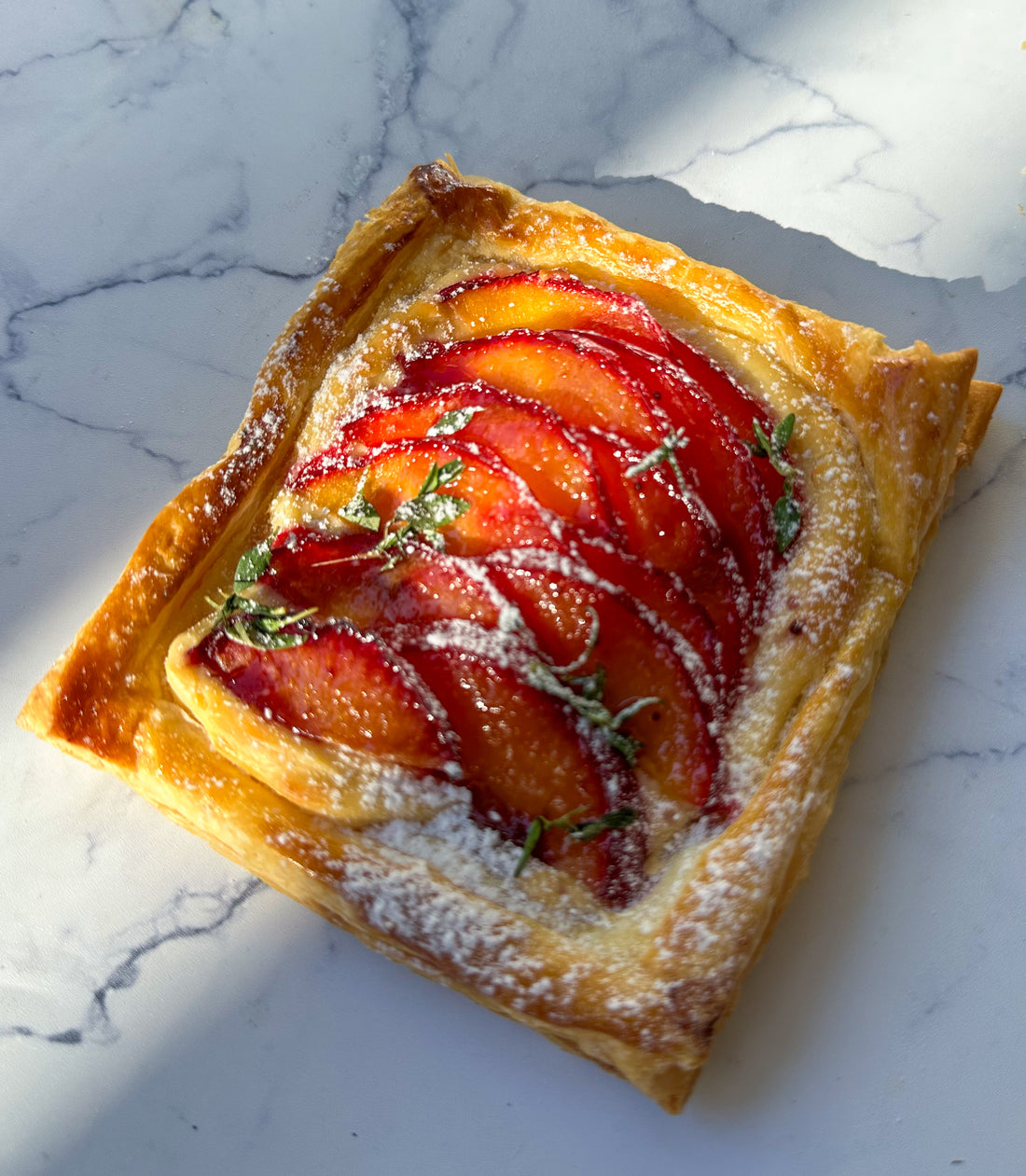 Plum and cream cheese puffed tarts