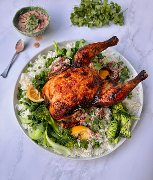 Asian inspired roast chicken with coconut rice and green vegetables.